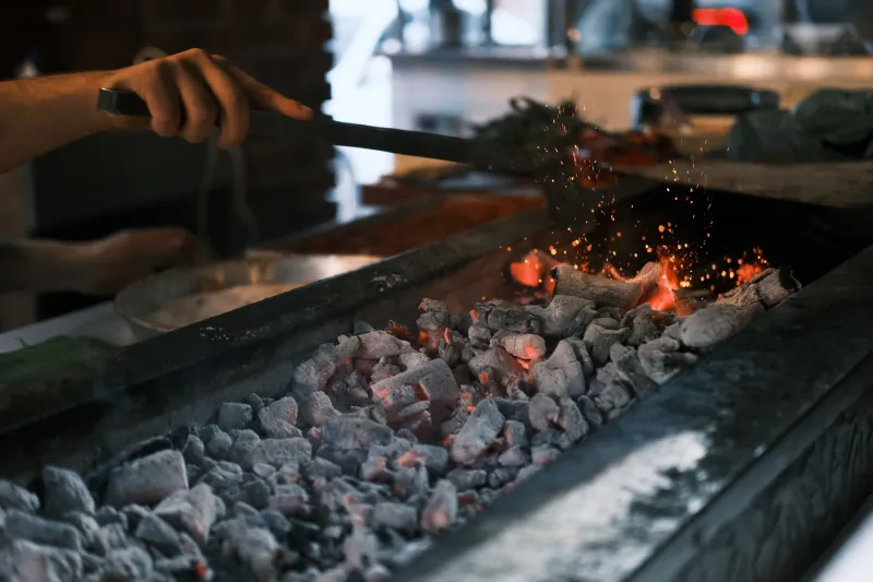 Burning Down the Blueprint: Why America's Top Restaurants Are Trading Gas Burners for the Chaos of Charcoal